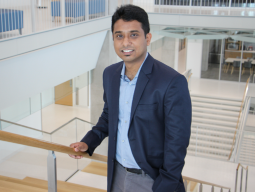 A man leaning on a railing.
