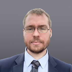 A portrait of AI learning specialist Cooper Greenfield