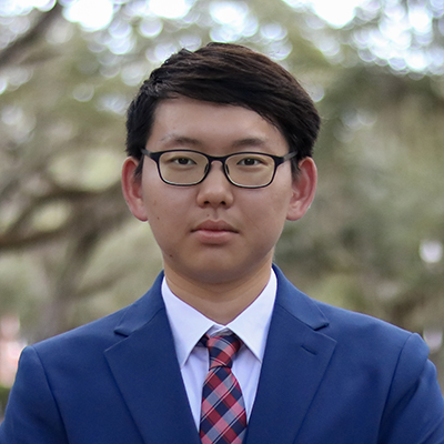 A male student in a suit.